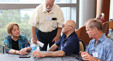 Three NFB members chat together at National Convention.